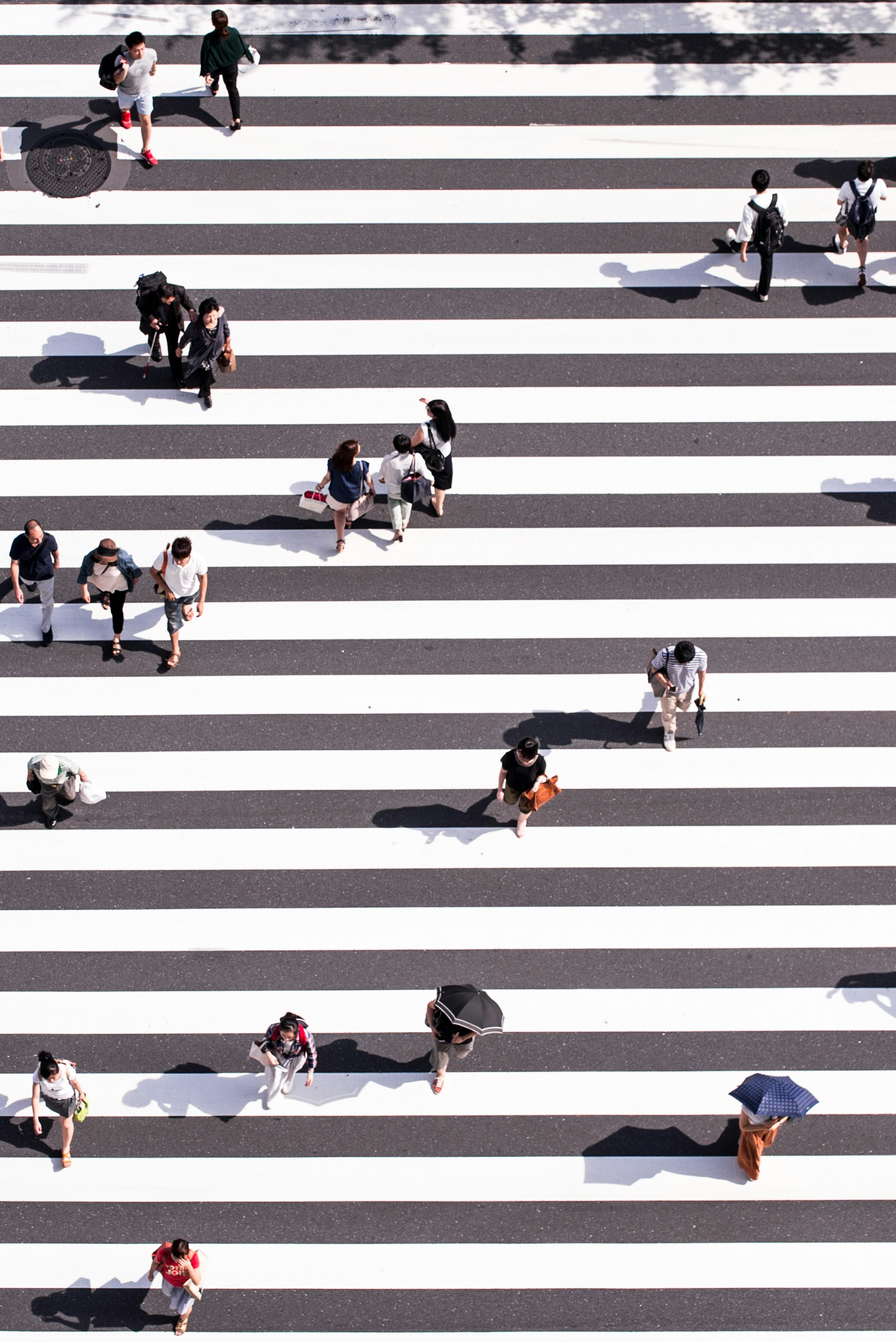 People walking outside on the crosswalk area