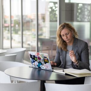 Woman reviewing notes in journal