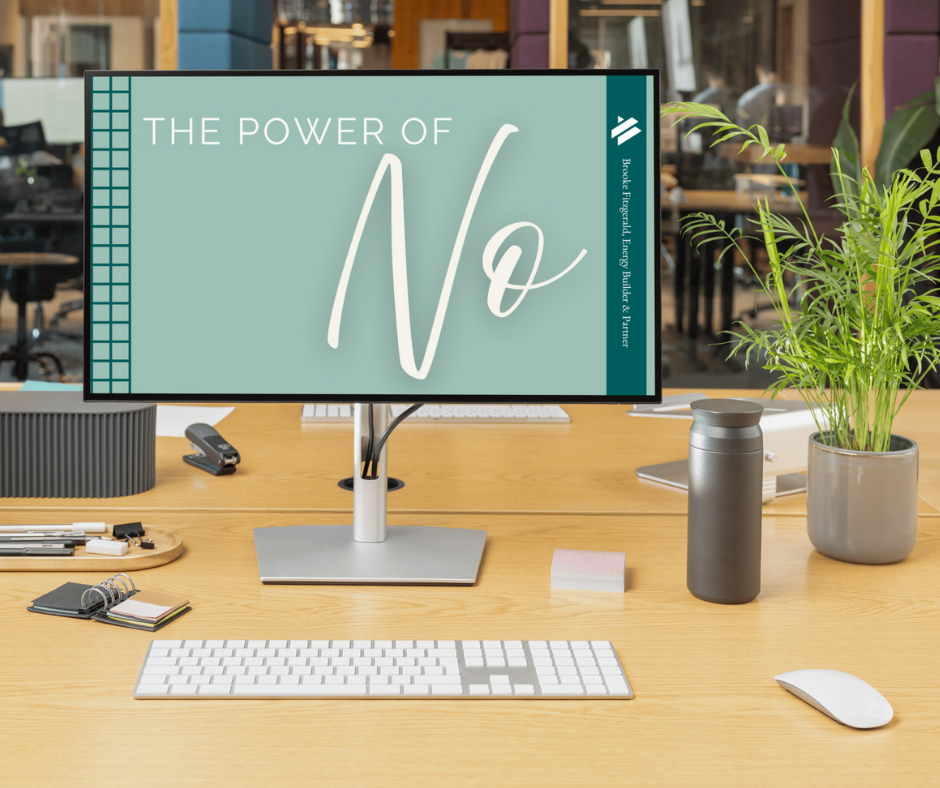 The Power of No slide appears on a desktop computer monitor in a modern office