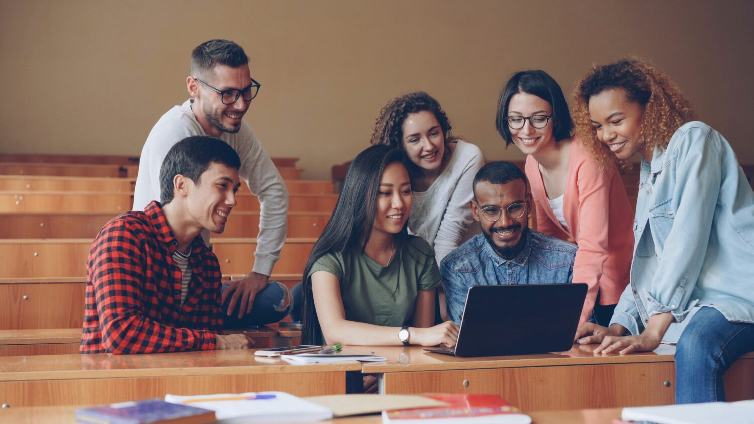 Group of co-workers learning on the computer together