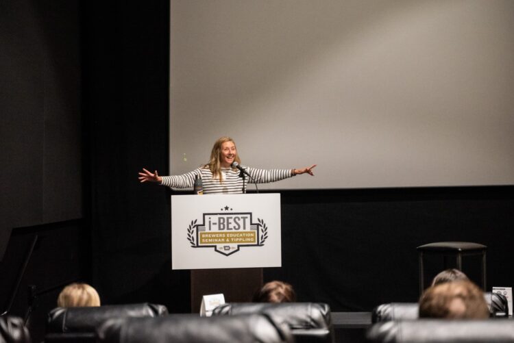 Brooke Fitzgerald on stage at a speaking event
